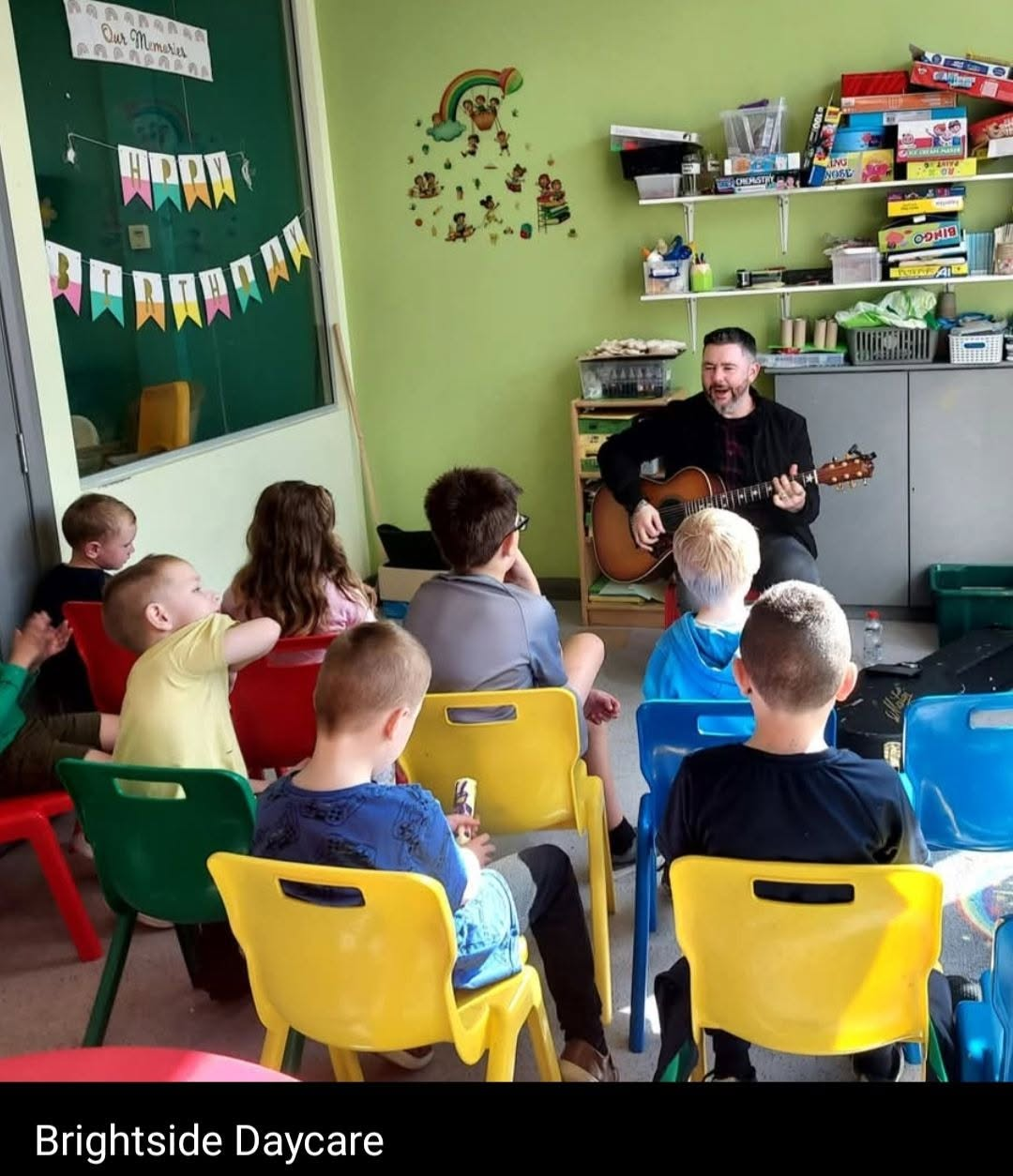 Guitar session with children at Brightside Daycare